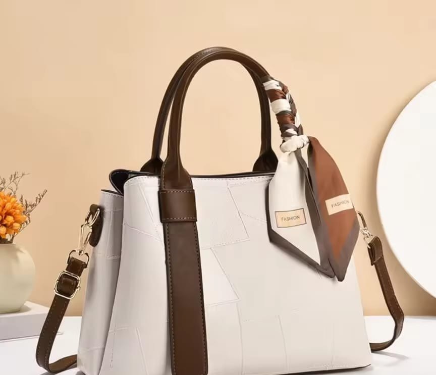 Cream tote with brown handles and silk scarf detail
