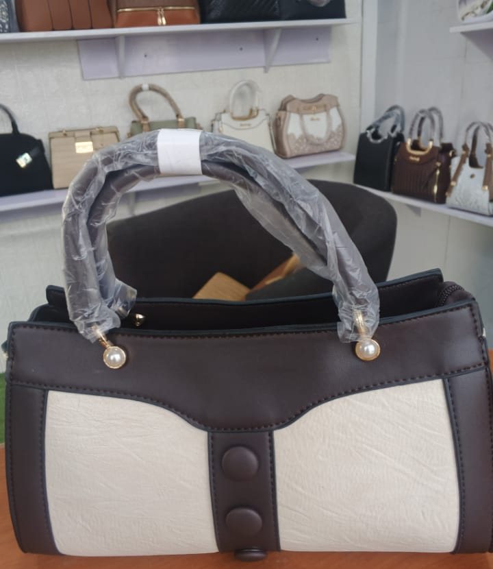 Ivory and brown two-tone barrel bag