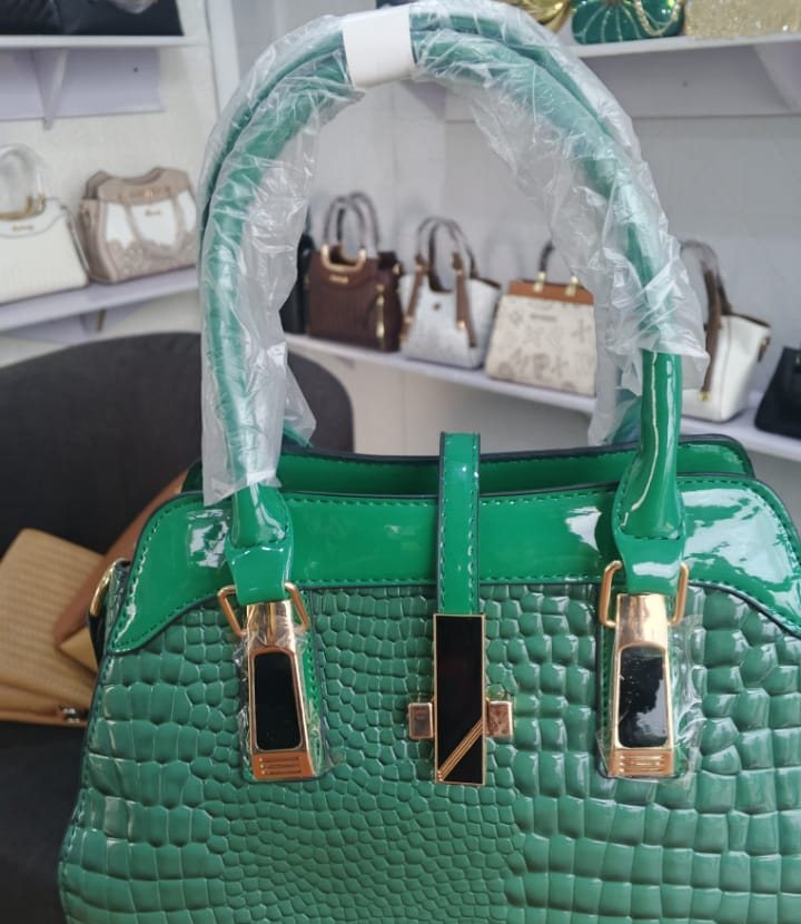 Emerald green crocodile-embossed pillow satchel