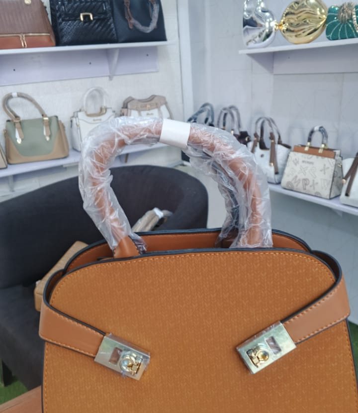 Amber belted satchel with gold locks