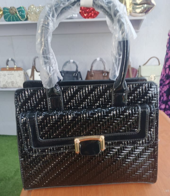 Black woven-texture satchel with gold clasp
