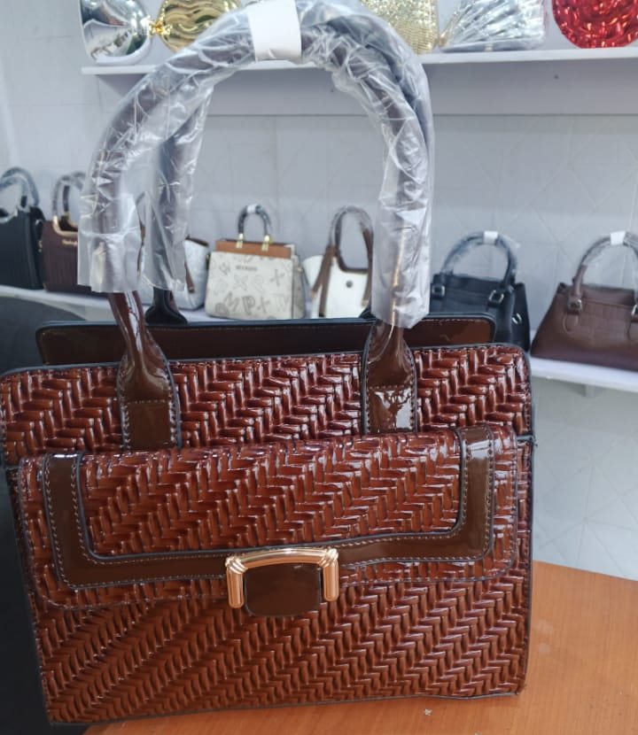 Tan woven-texture satchel with gold clasp